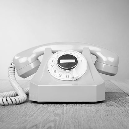 A rotary dial telephone.